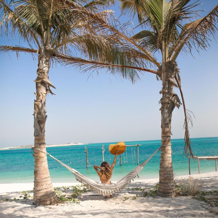 Hotel Nurai Island, Saadiyat Abu Dabi Exterior foto Hammock on the beach